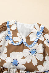 Blusa con mangas anudadas y estampado floral a rayas