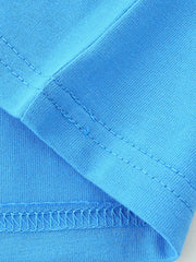 Close up of sky blue children's t-shirt seam stitching and smooth cotton fabric