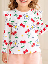 Front view of a children's white long sleeve tee with red cherry and daisy prints and ruffled shoulders