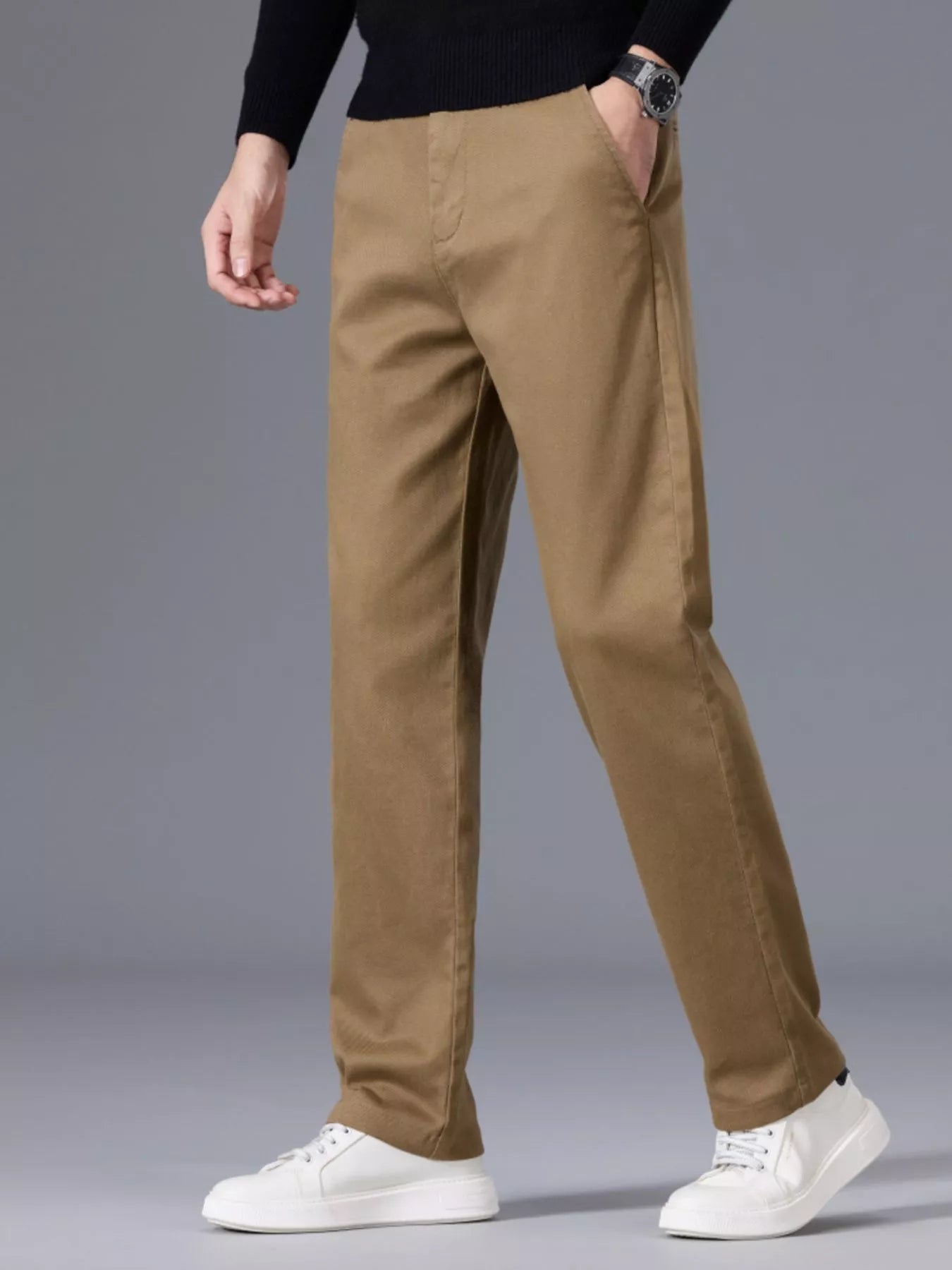 Men's khaki slim-fit pants made from cotton with pockets.