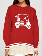 Front view of a red dropped shoulder sweater with a white golf cart graphic and striped trim.