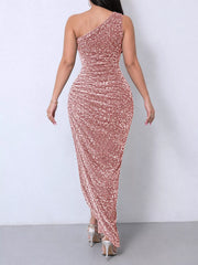 Pink sequin one shoulder evening dress worn from the back showing the ruched bodice