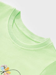 Close-up detail of the light green round neckline and butterfly appliqué on children's tee