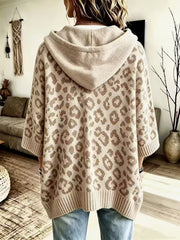 Back view of cream leopard print oversized hooded knit sweater with solid cream hood