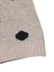 Close up of khaki polka dot sweater ribbed hem and knit texture detail