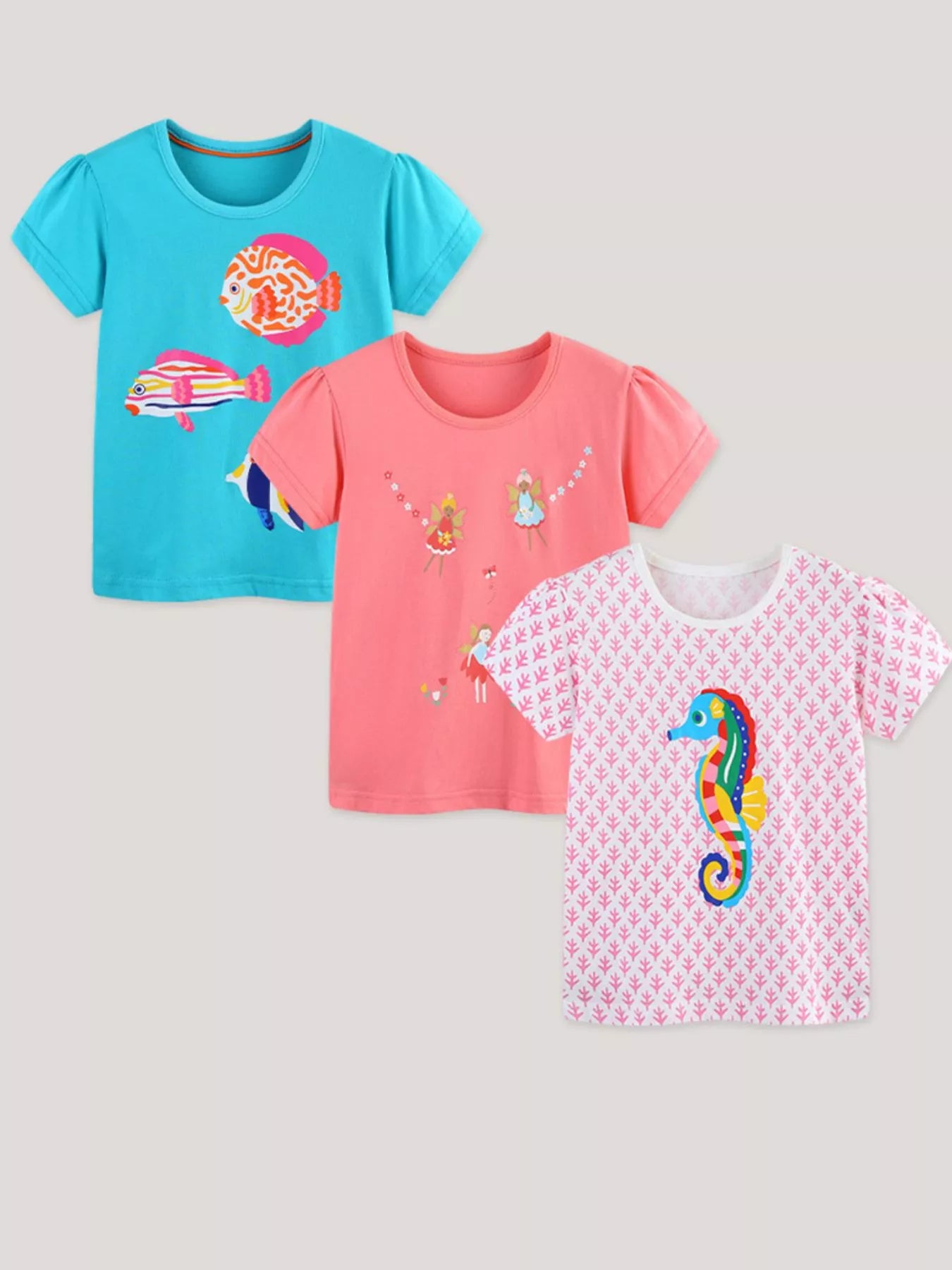 Children's multicolor three-piece T-shirt set featuring graphics and short sleeves.