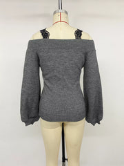 Back view of dark grey off shoulder lace trim sweater displayed on mannequin