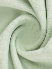 Close view of light green fabric texture on a floral bodycon mermaid maxi dress