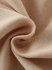 Close-up texture of the soft tan fabric of the children's sleeveless top