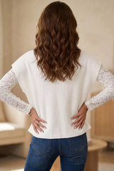 Back view of a white ribbed mock neck top with white lace long sleeves