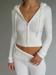 Front view of white ribbed zip up hooded cardigan with matching knit pants