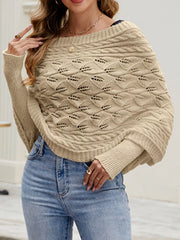 Front view of beige batwing sweater with wide neckline and cable knit texture.