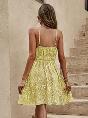 Women's yellow green floral mini cami dress with a V-neckline.