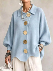 Front view of a sky blue knit cardigan with large gold buttons