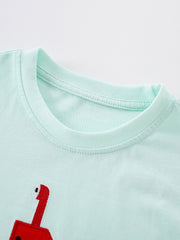 Close view of the mint children's tee neckline showing neat ribbed stitching and soft fabric