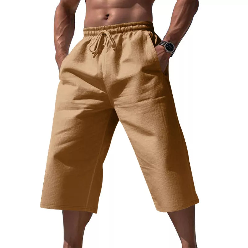 Men's earthy yellow cropped casual pants with a drawstring waist and pockets.