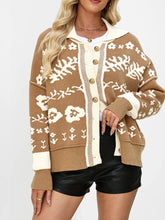 Tan floral knit cardigan with cream collar and buttons worn partly open