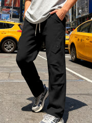Men's black cargo pants with a drawstring waist and pockets.