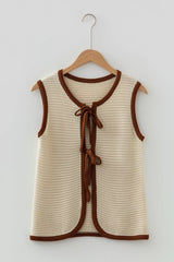 Front view of a beige tie front sweater vest with brown contrast trim on a hanger