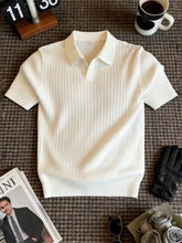Men's ribbed knit polo shirt with a classic collar and seam details.