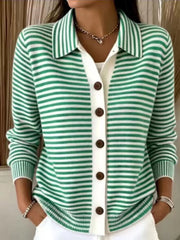 On-model front view of green and white striped collared cardigan with brown buttons