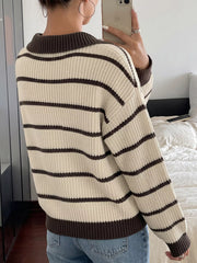 Back mirror view of a cream and brown striped knit polo sweater with long sleeves.