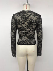 Back view of a black floral lace long-sleeve top displayed on a mannequin.