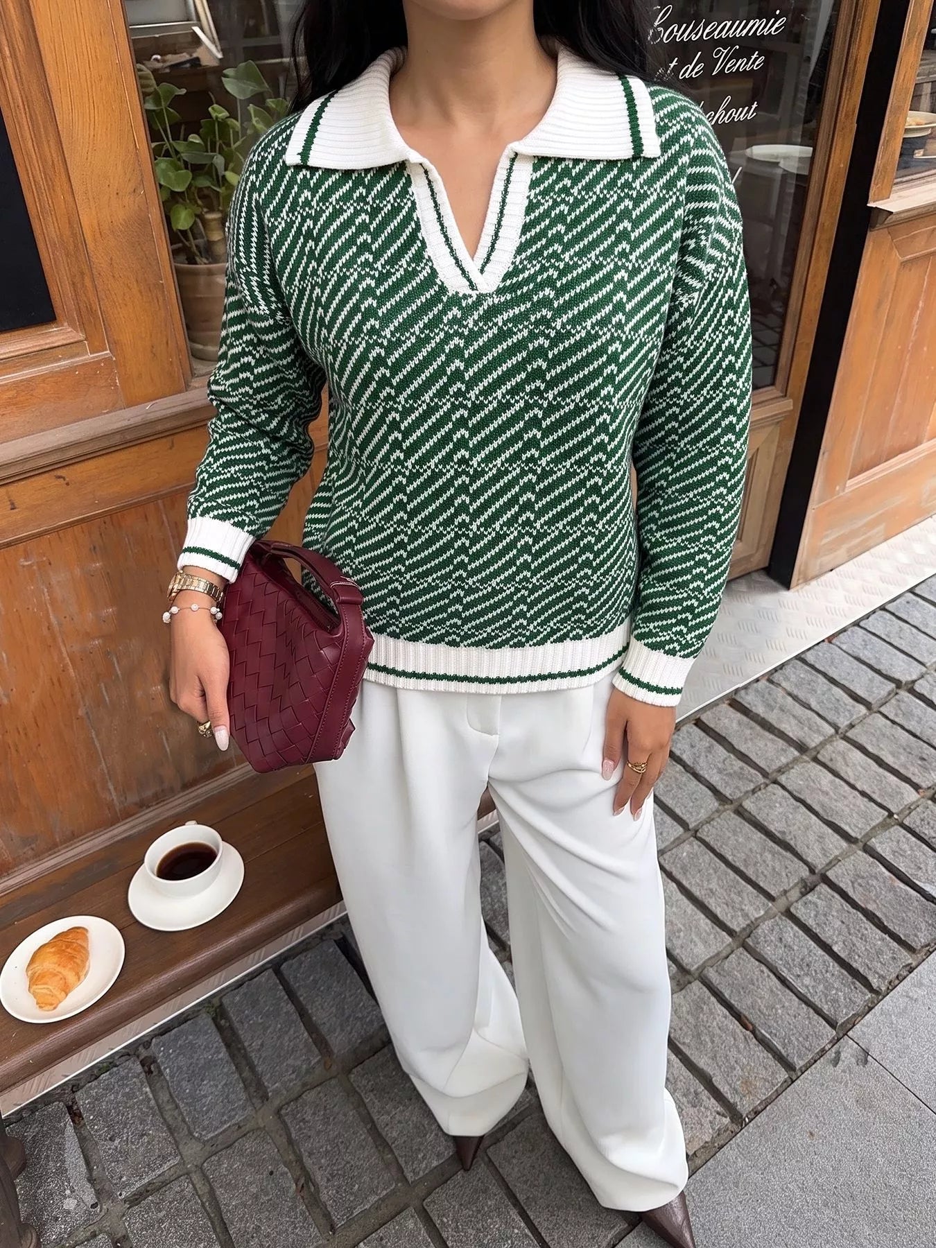 Outdoor on-model front view of the green and white geometric collared sweater