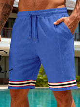 Men's blue textured knit shorts with a drawstring waist and pockets.