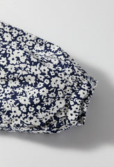 Blusa de manga larga con muescas y estampado floral