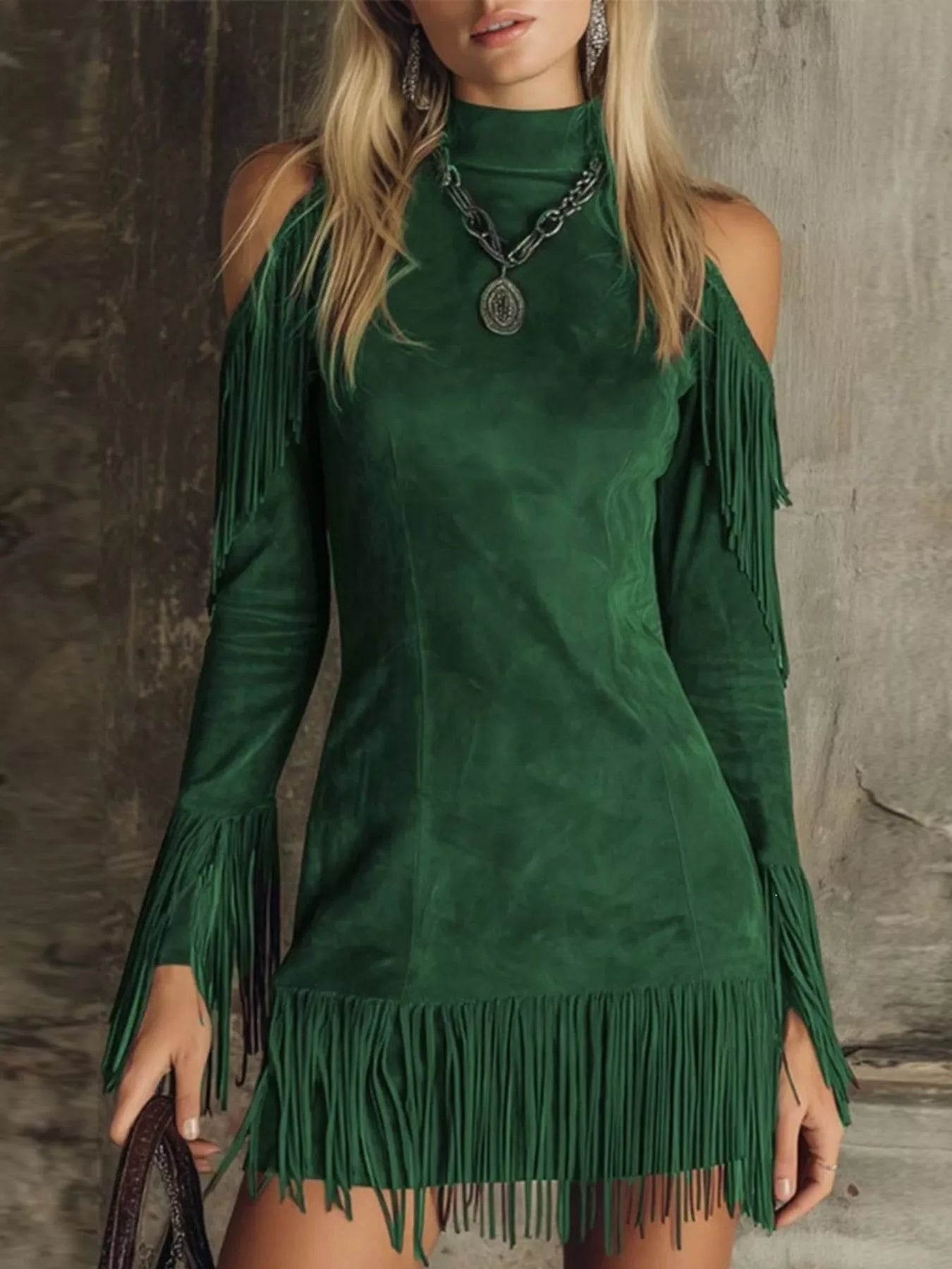 Green fringed cold shoulder mini dress worn front with long sleeves and fringe hem