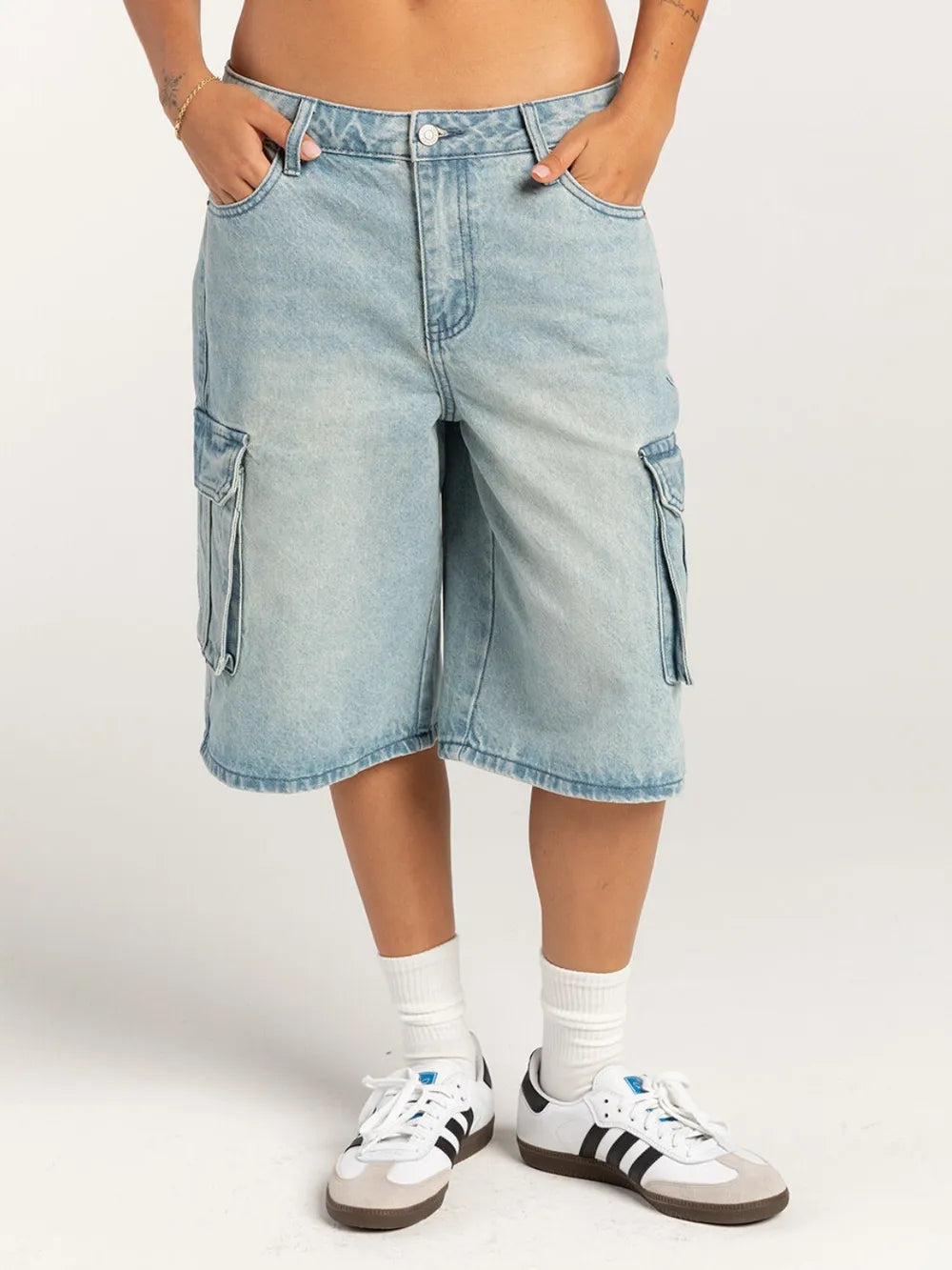 Women's mid-rise denim shorts with buttons and pockets.