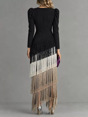 Studio back view of a black fringed maxi dress with cream and taupe fringe tiers