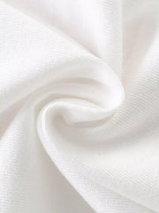 Close-up of soft folded white knit fabric texture of children's short sleeve t-shirt
