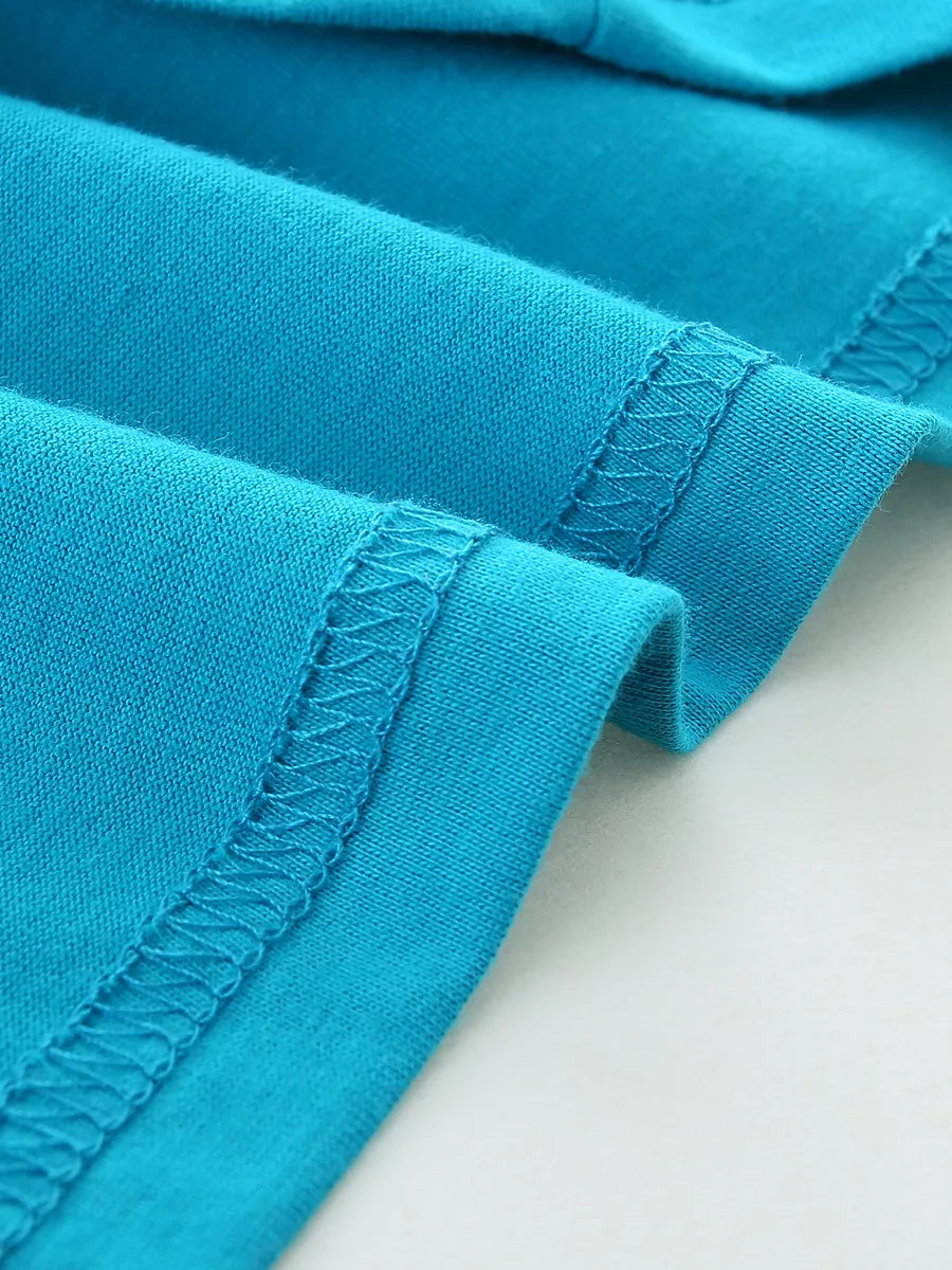 Close-up of the sky blue hem stitching detail on a children's round neck T-shirt