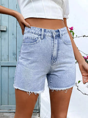 Women's denim shorts with frayed hems, button fastening, and pockets.