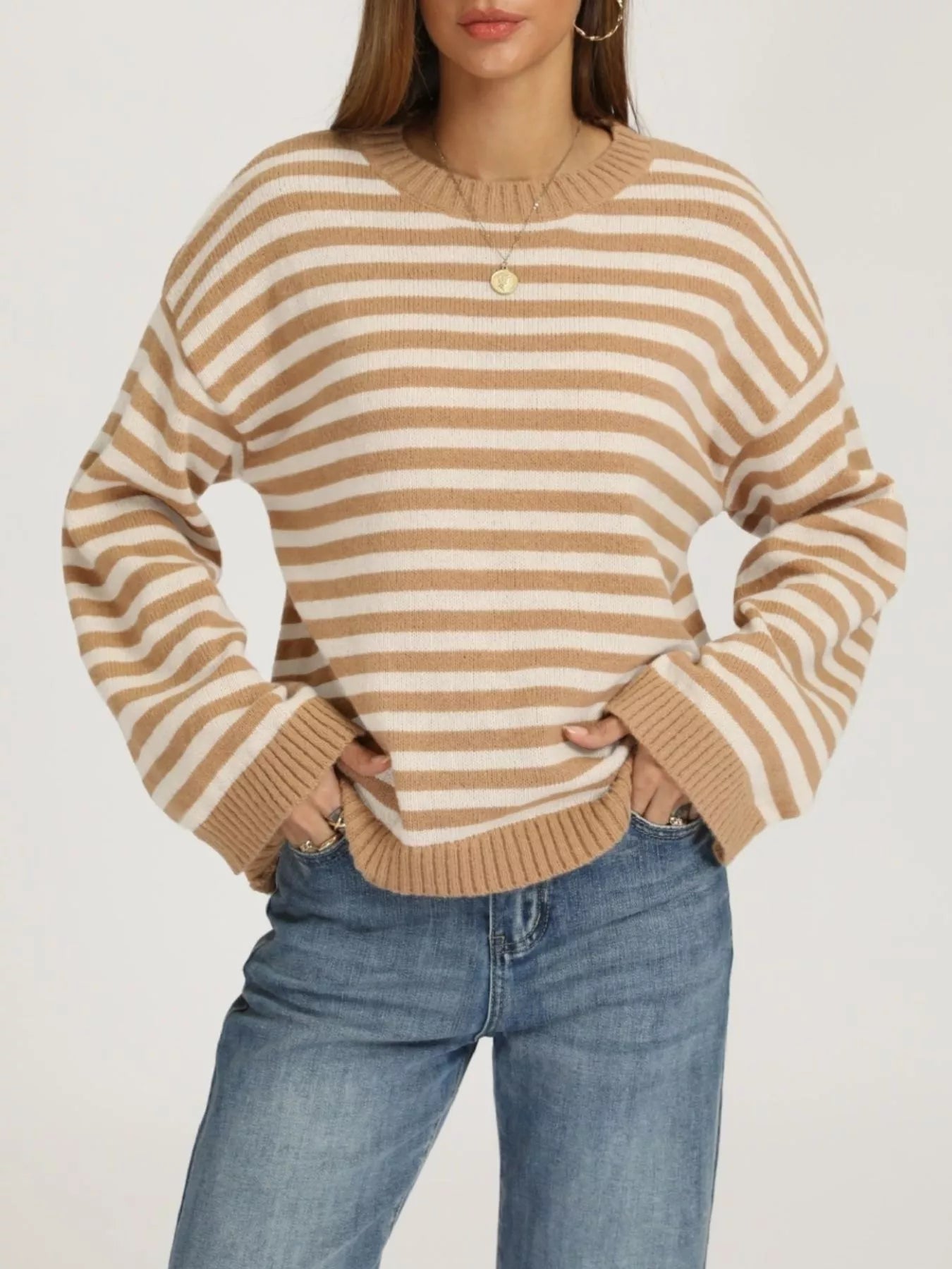 Front view of a khaki and white striped dropped shoulder sweater with ribbed cuffs and hem.