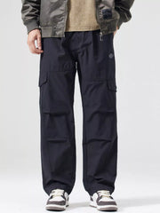 Men's black wide-leg cargo pants with a drawstring waist and pockets.