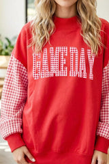 Straight front view of red mock neck sweatshirt with plaid sleeves and GAME DAY lettering