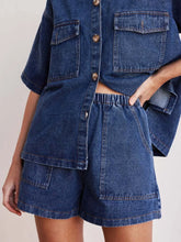 Women's denim shorts with an elastic waistband, drawstring, and pockets.