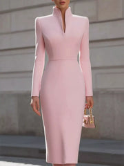 Pink stand collar long sleeve midi dress worn outdoors, front view with small handbag