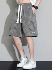 Men's military green cargo shorts with a drawstring waist and pockets.