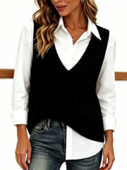 Black V neck sleeveless knit sweater vest layered over white collared shirt, front view