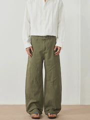 Men's army green wide-leg pants with an oversized fit and pockets.