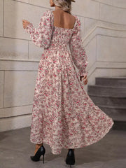 Back view of pink floral midi dress showing open square back and long sleeves