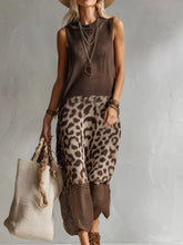 Front view of a brown sleeveless knit dress with a leopard print skirt panel