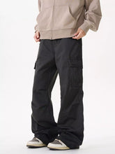 Men's grey cotton cargo pants with a loose fit and pockets.