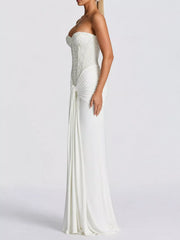 White strapless sequin corset maxi dress on model, full length side profile in studio