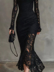 Lower detail view of the black lace mock neck mermaid midi dress showing the flared hem
