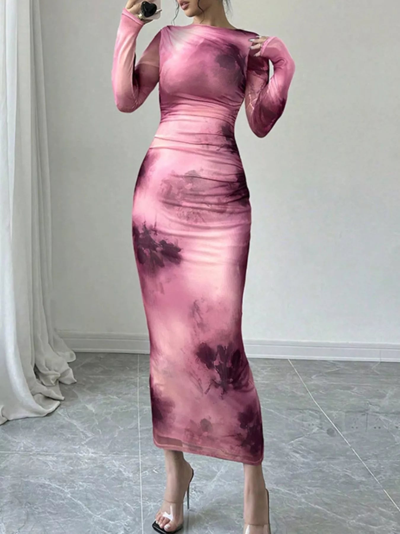 Pink tie dye long sleeve bodycon maxi dress with sheer mesh sleeves in a mirror selfie